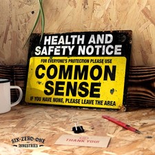 Listing image for Common Sense Health and Safety Metal sign. Worn look rusty print Funny work site